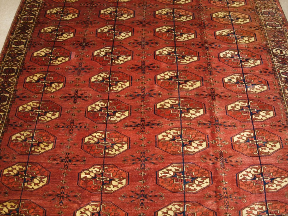 ANTIQUE TEKKE TURKMEN MAIN CARPET WITH RARE OCTAGONAL GULS, MID 19TH CENTURY. View V