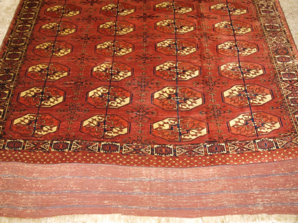 ANTIQUE TEKKE TURKMEN MAIN CARPET WITH RARE OCTAGONAL GULS, MID 19TH CENTURY. View VI