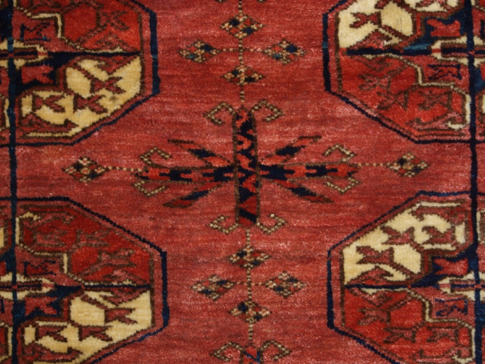 ANTIQUE TEKKE TURKMEN MAIN CARPET WITH RARE OCTAGONAL GULS, MID 19TH CENTURY. View XIII