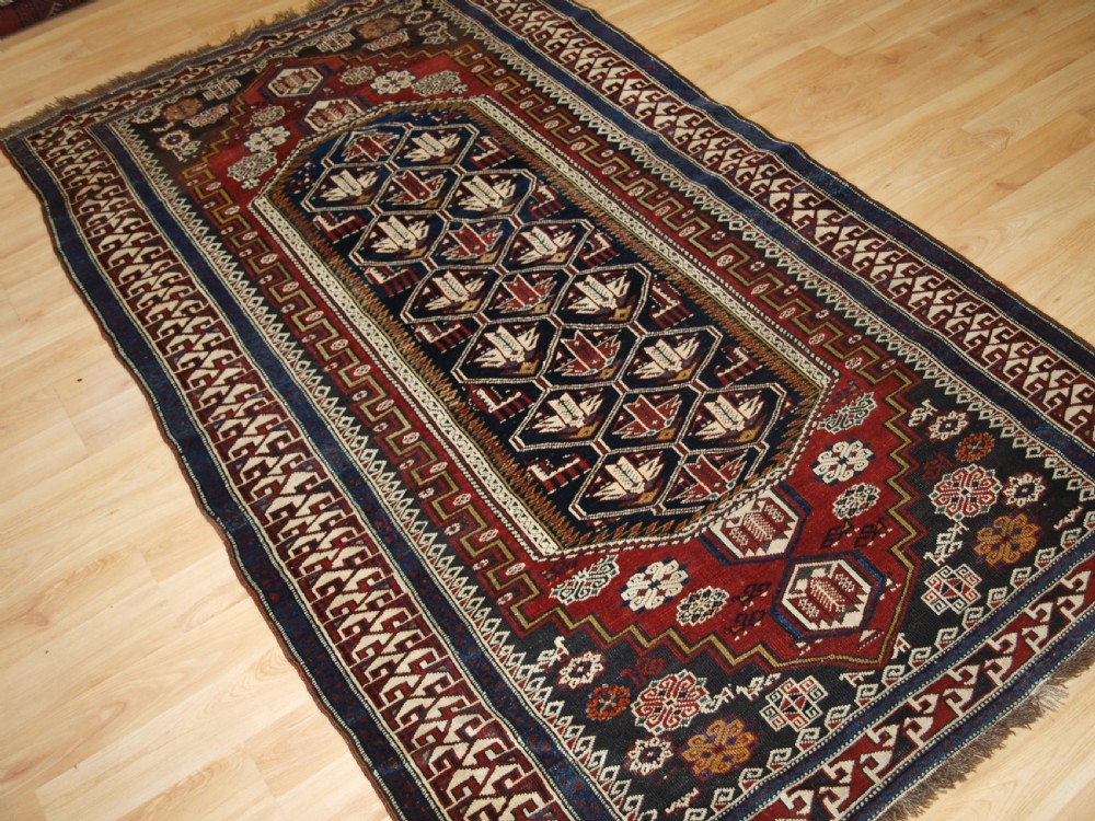 ANTIQUE CAUCASIAN SHIRVAN RUG OF THE BIRD DESIGN, CIRCA 1900. View II