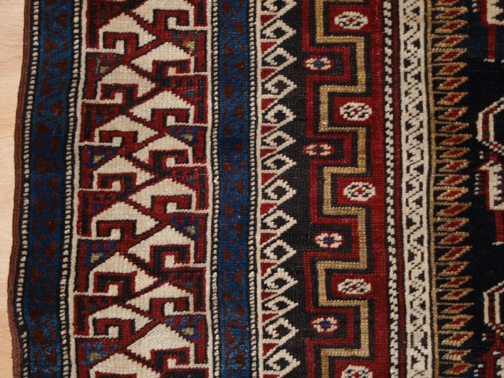ANTIQUE CAUCASIAN SHIRVAN RUG OF THE BIRD DESIGN, CIRCA 1900. View IV