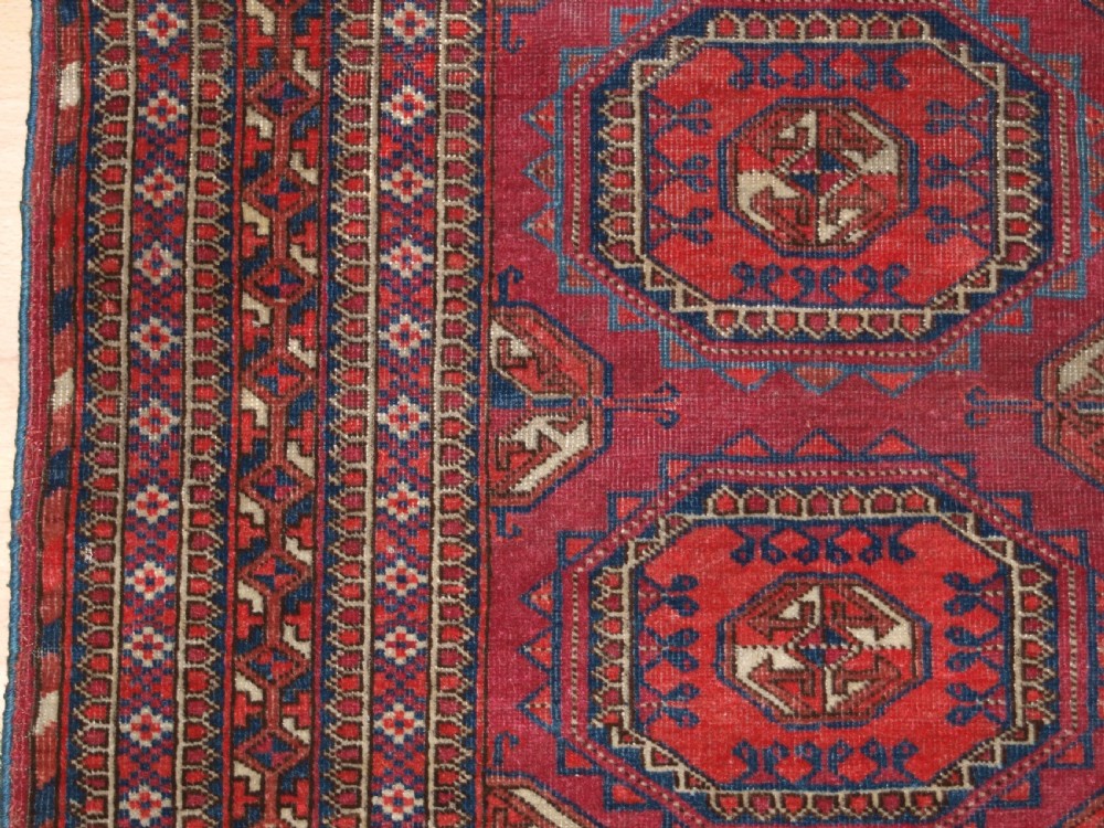 ANTIQUE TEKKE TURKMEN RUG WITH SALOR GULS, COCHINEAL COLOUR, CIRCA 1890. View IV