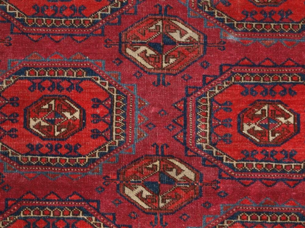 ANTIQUE TEKKE TURKMEN RUG WITH SALOR GULS, COCHINEAL COLOUR, CIRCA 1890. View IX