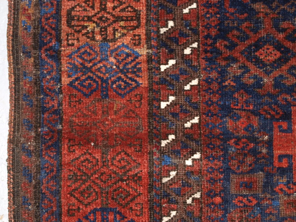 ANTIQUE TIMURI BALUCH RUG OF SINGLE MEDALLION DESIGN, CIRCA 1880. View IV