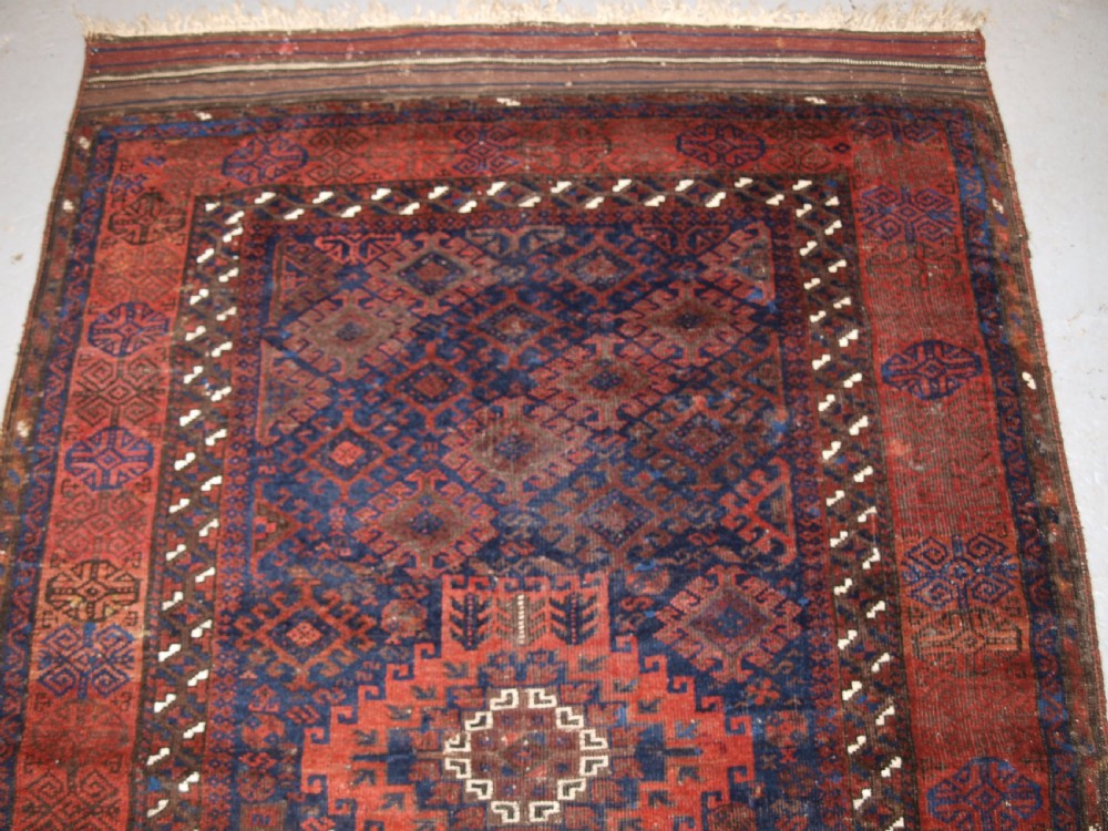 ANTIQUE TIMURI BALUCH RUG OF SINGLE MEDALLION DESIGN, CIRCA 1880. View V