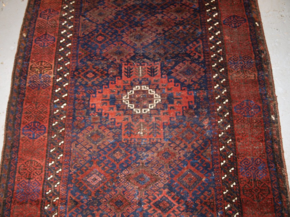 ANTIQUE TIMURI BALUCH RUG OF SINGLE MEDALLION DESIGN, CIRCA 1880. View VI
