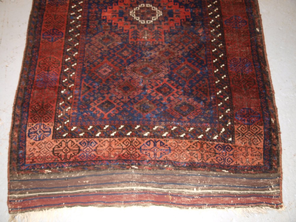 ANTIQUE TIMURI BALUCH RUG OF SINGLE MEDALLION DESIGN, CIRCA 1880. View VII