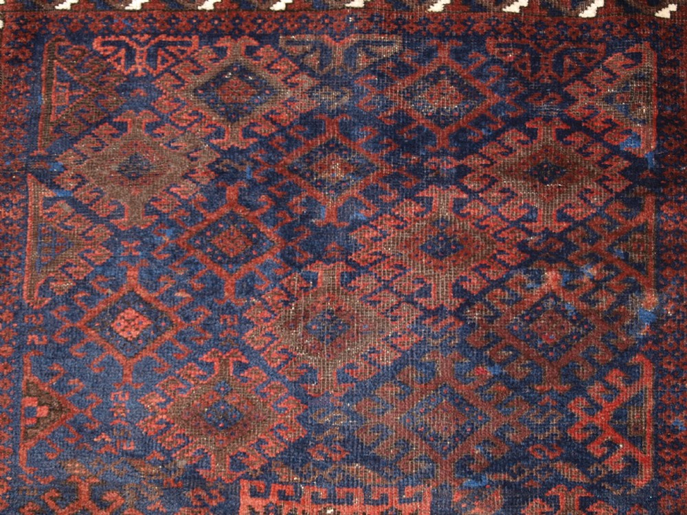 ANTIQUE TIMURI BALUCH RUG OF SINGLE MEDALLION DESIGN, CIRCA 1880. View IX