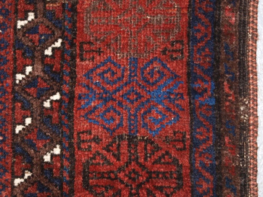 ANTIQUE TIMURI BALUCH RUG OF SINGLE MEDALLION DESIGN, CIRCA 1880. View XIV