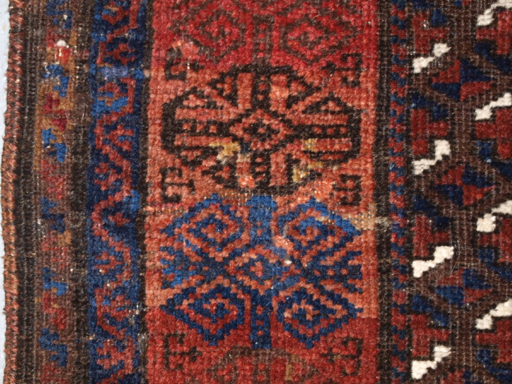 ANTIQUE TIMURI BALUCH RUG OF SINGLE MEDALLION DESIGN, CIRCA 1880. View XV
