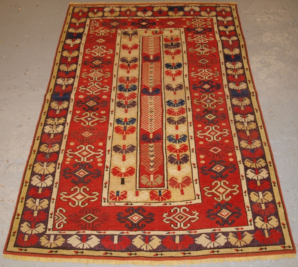 ANTIQUE TURKISH MILAS VILLAGE RUG OF SCARCE DESIGN, CIRCA 1850.