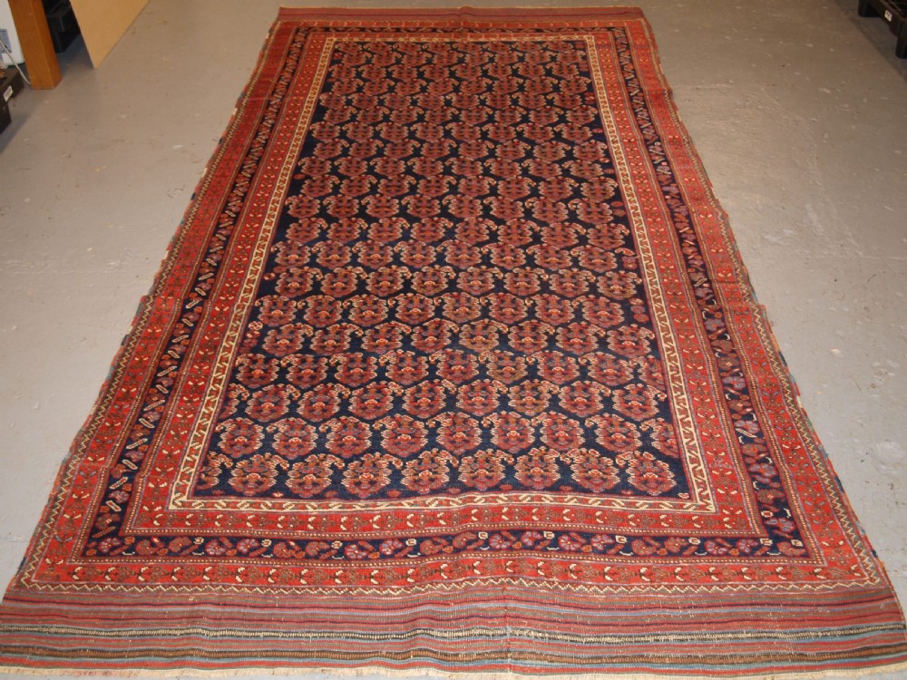 ANTIQUE LONG RUG BY THE AFSHAR TRIBE, BOTEH DESIGN, CIRCA 1890.