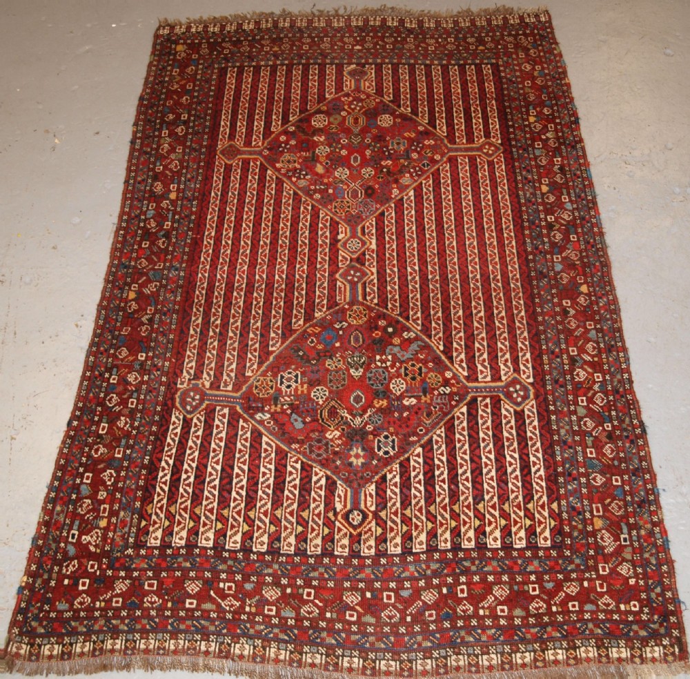 ANTIQUE TRIBAL KHAMSEH RUG WITH CANE DESIGN, CIRCA 1880.