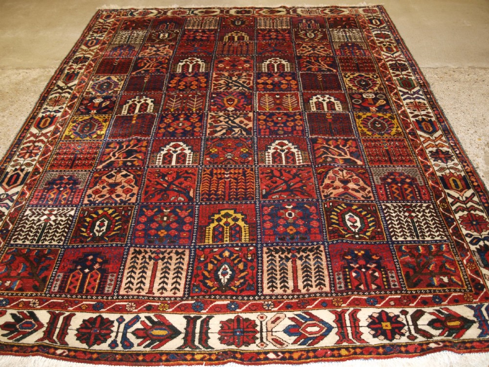 ANTIQUE BAKHTIARI CARPET OF GARDEN DESIGN, CIRCA 1900/20.