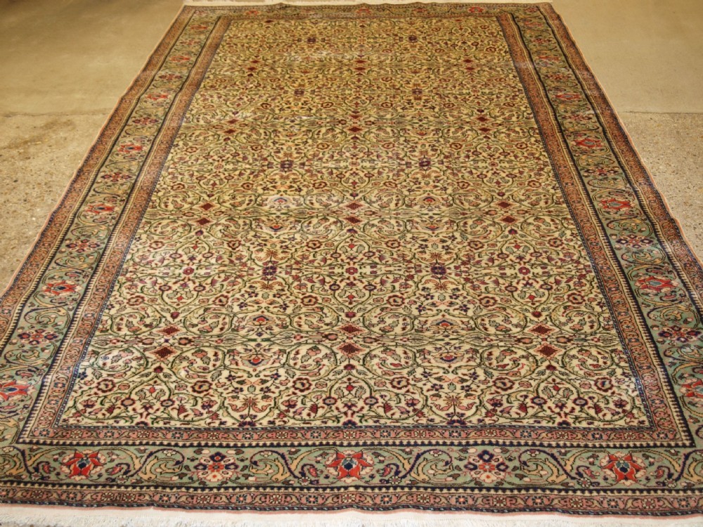 OLD TURKISH KAYSERI CARPET, SOFT COLOUR, PALE GREEN BORDER, CIRCA 1930. View II