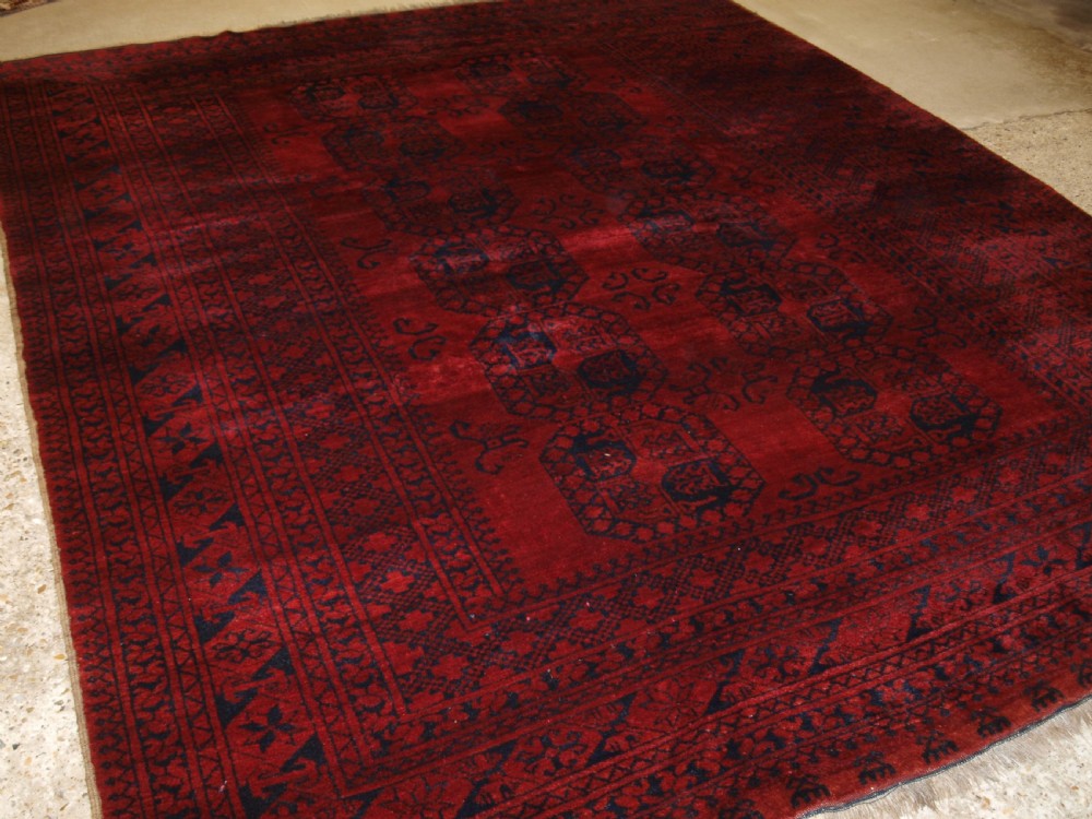 OLD AFGHAN ERSARI VILLAGE CARPET, RICH DEEP RED COLOUR, CIRCA 1920.