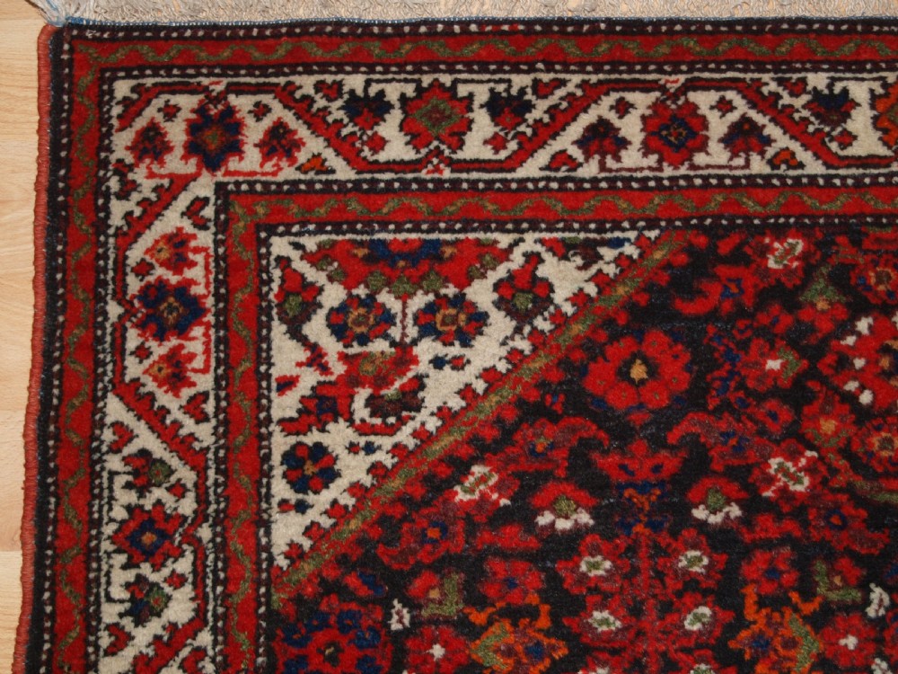 ANTIQUE MALAYER VILLAGE RUG , FLORAL SHRUB DESIGN, CIRCA 1920. View III