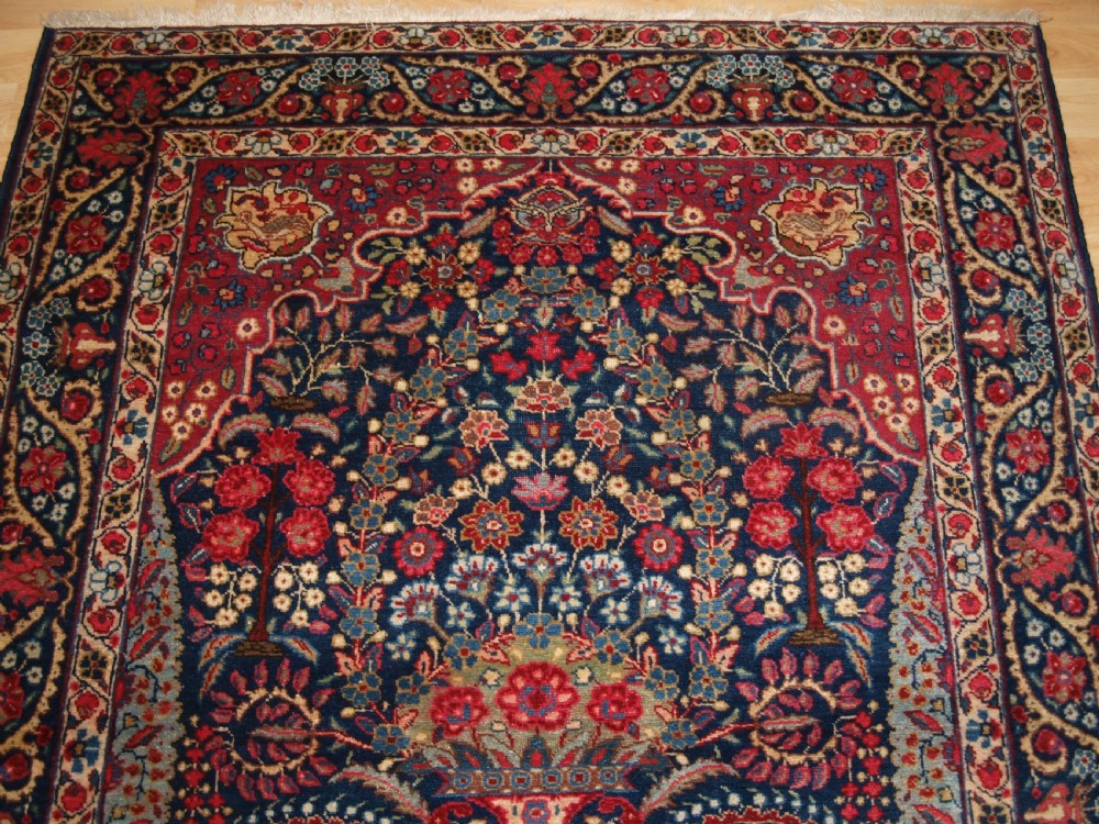ANTIQUE TABRIZ RUG OF FLORAL VASE PRAYER DESIGN, ONE OF A PAIR, CIRCA 1920. View III