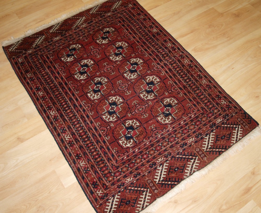 ANTIQUE TEKKE TURKMEN RUG, SMALL SIZE AND GOOD COLOUR, CIRCA 1900. View II