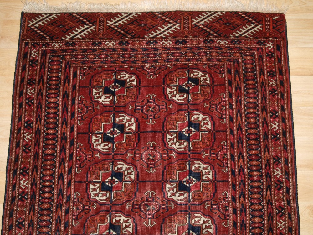 ANTIQUE TEKKE TURKMEN RUG, SMALL SIZE AND GOOD COLOUR, CIRCA 1900. View IV