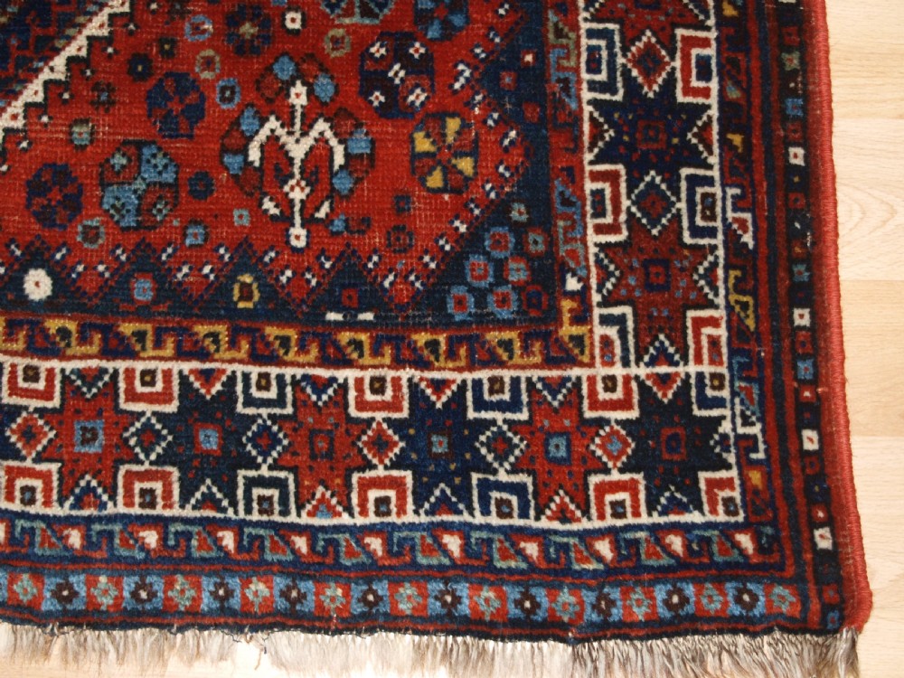OLD KHAMSEH SHIRAZ RUG, CIRCA 1920. View VIII