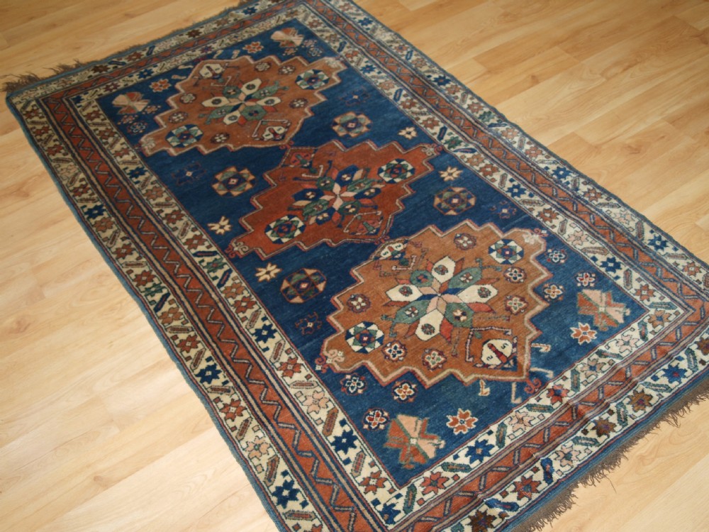 ANTIQUE CAUCASIAN DERBENT TRIPLE MEDALLION RUG, CIRCA 1900. View III