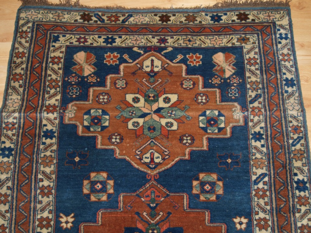 ANTIQUE CAUCASIAN DERBENT TRIPLE MEDALLION RUG, CIRCA 1900. View IV