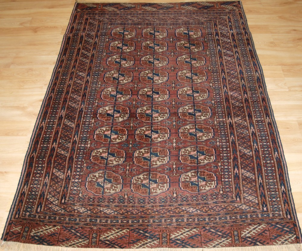 ANTIQUE TEKKE TURKMEN RUG, SOFT COLOUR, LIVED WITH LOOK, CIRCA 1900.