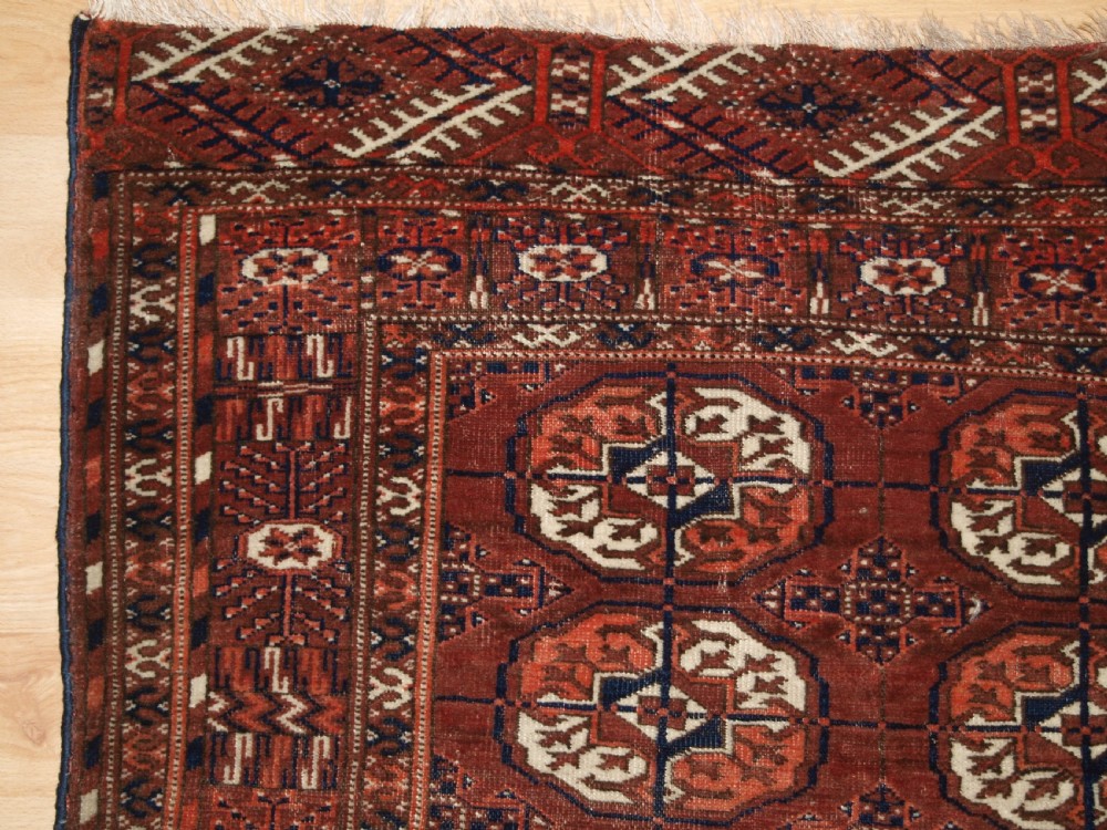 ANTIQUE TEKKE TURKMEN RUG, SMALL SIZE, RED / BROWN COLOUR, CIRCA 1900. View II