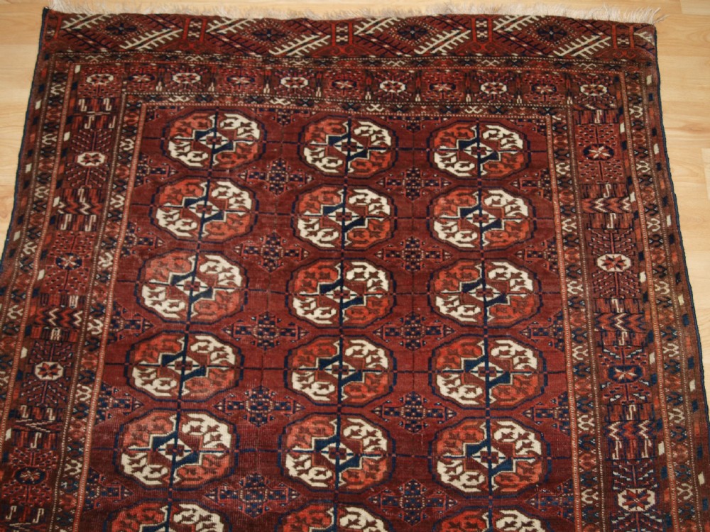 ANTIQUE TEKKE TURKMEN RUG, SMALL SIZE, RED / BROWN COLOUR, CIRCA 1900. View III