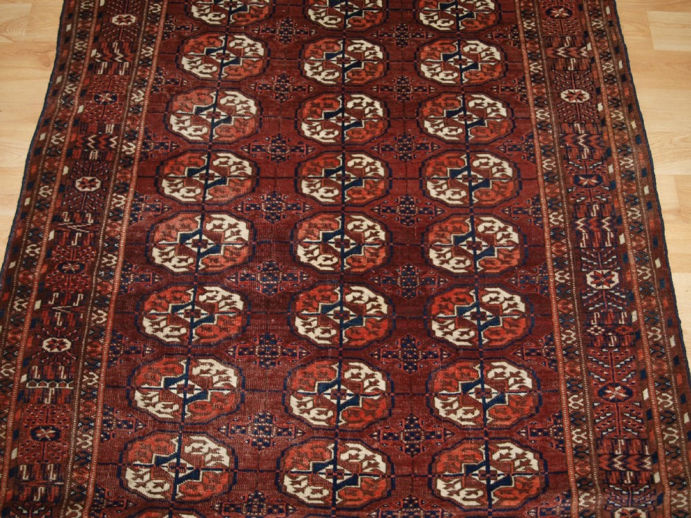 ANTIQUE TEKKE TURKMEN RUG, SMALL SIZE, RED / BROWN COLOUR, CIRCA 1900. View IV