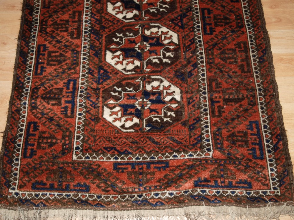 ANTIQUE MAHDAD KHANI BALUCH RUG, LARGE TURKMEN GULS, CIRCA 1900. View VI