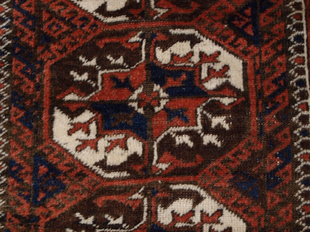 ANTIQUE MAHDAD KHANI BALUCH RUG, LARGE TURKMEN GULS, CIRCA 1900. View VII
