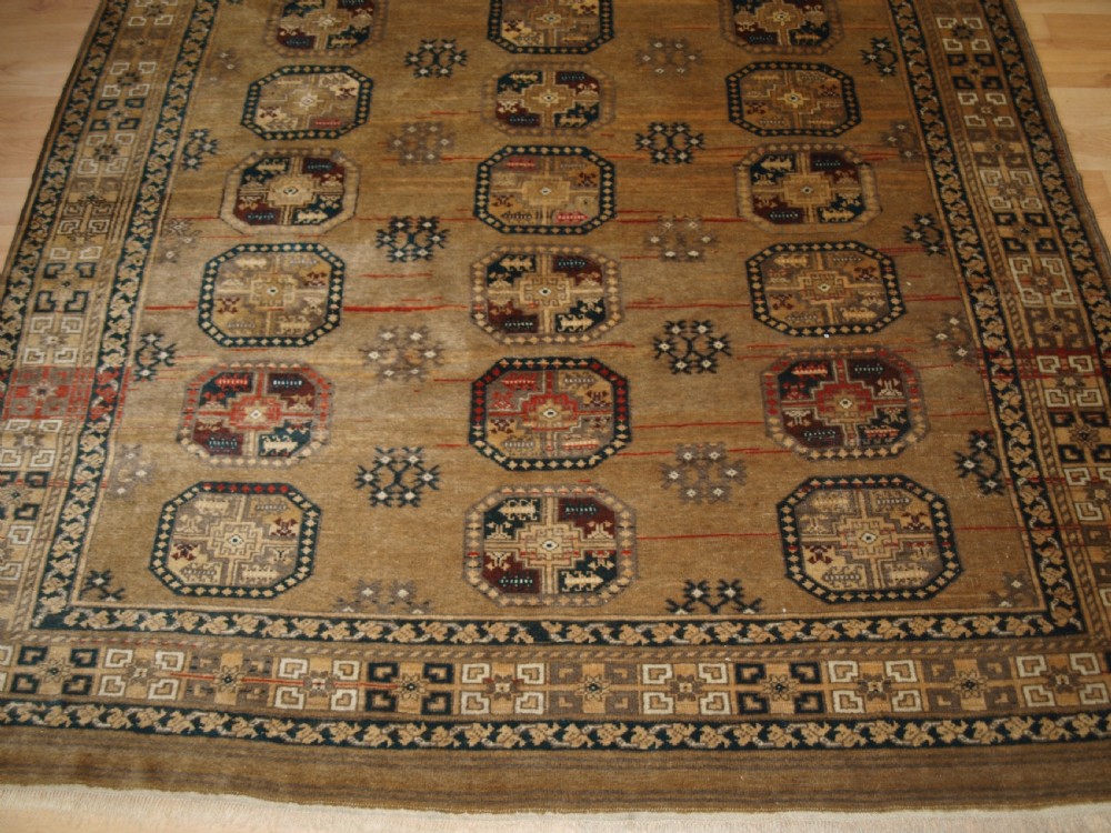 OLD FADED AFGHAN RUG WITH ERSARI TURKMEN DESIGN, CIRCA 1920/30. View IV