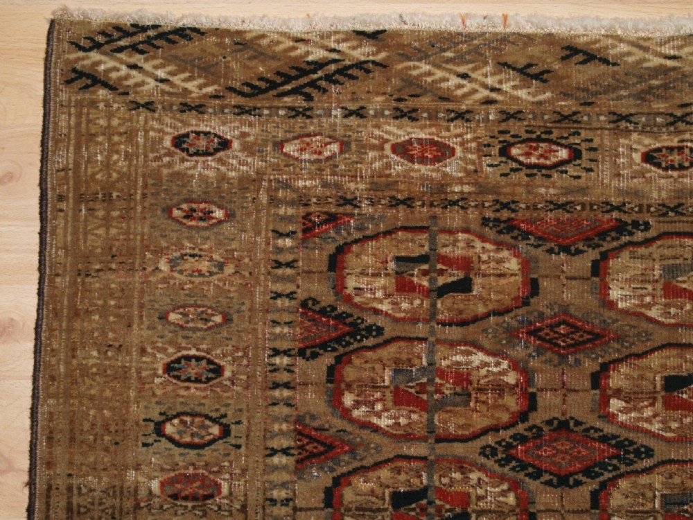 ANTIQUE TEKKE TURKMEN RUG WITH FADED COLOURS, CIRCA 1900. View II