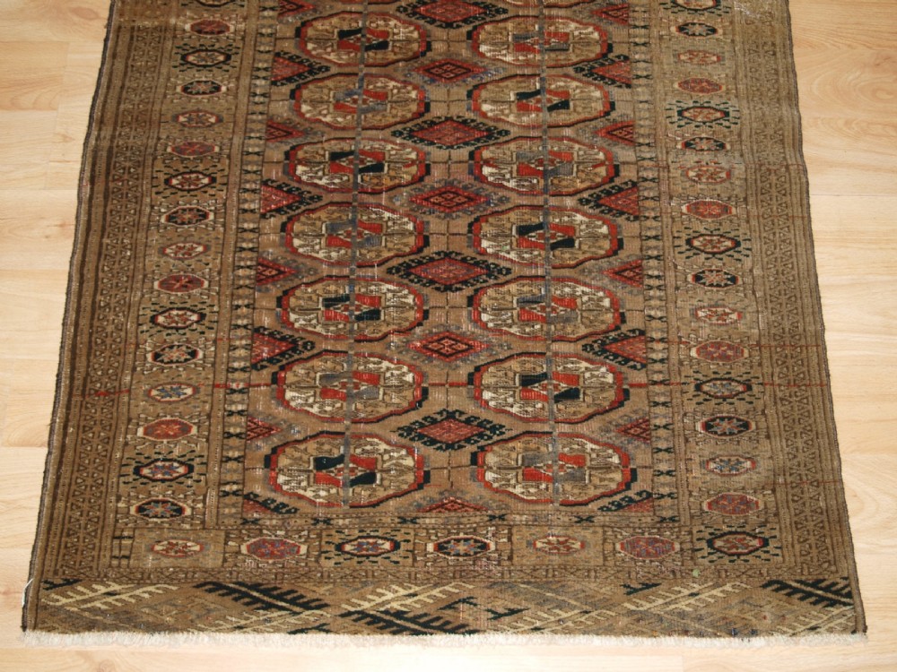 ANTIQUE TEKKE TURKMEN RUG WITH FADED COLOURS, CIRCA 1900. View V