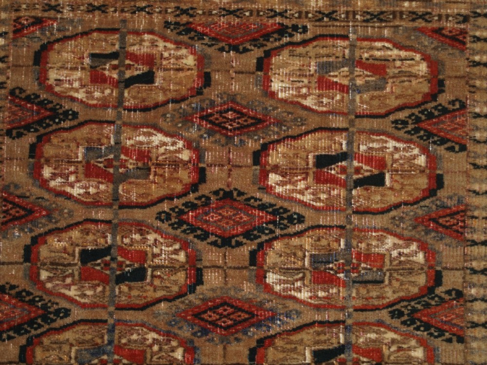 ANTIQUE TEKKE TURKMEN RUG WITH FADED COLOURS, CIRCA 1900. View VI