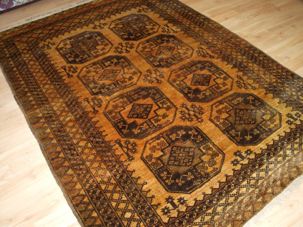 OLD AFGHAN ERSARI RUG, FADED GOLD COLOUR, CIRCA 1920/30.
