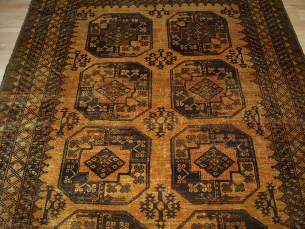 OLD AFGHAN ERSARI RUG, FADED GOLD COLOUR, CIRCA 1920/30. View IV