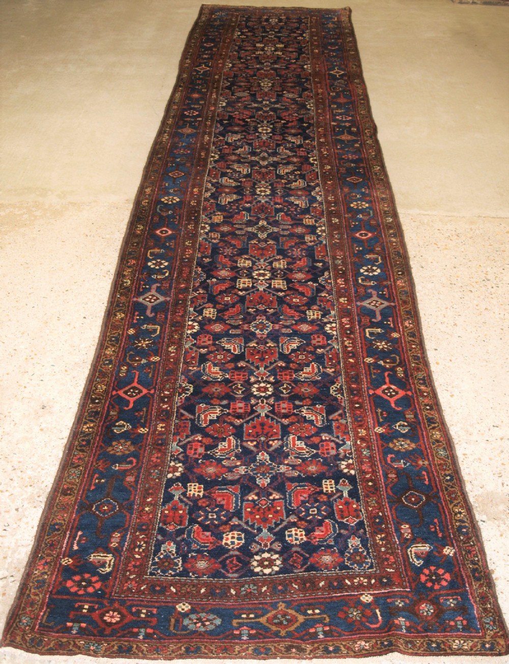 ANTIQUE KURDISH HAMADAN REGION RUNNER, ALL OVER HERATI DESIGN, CIRCA 1900.