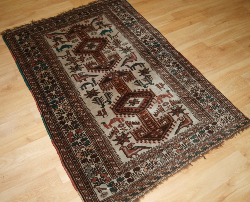 OLD KURDISH VILLAGE RUG, HOOKED MEDALLIONS WITH ANIMALS, CIRCA 1920. View II