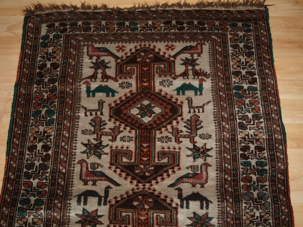 OLD KURDISH VILLAGE RUG, HOOKED MEDALLIONS WITH ANIMALS, CIRCA 1920. View IV