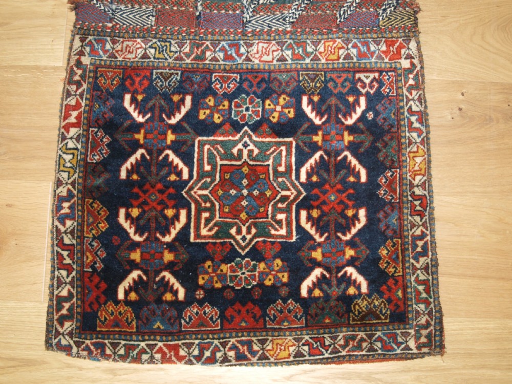 ANTIQUE COMPLETE KHORJIN SADDLEBAGS BY THE KHAMSEH TRIBE, CIRCA 1880. View IV
