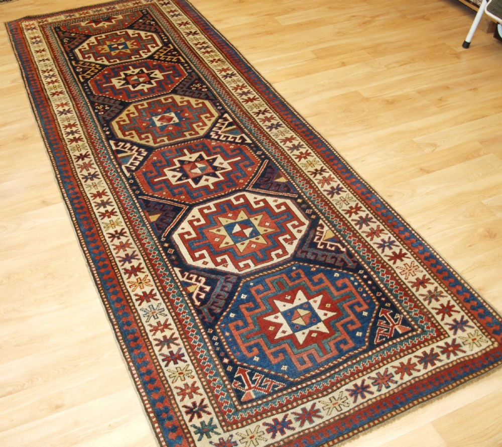 ANTIQUE CAUCASIAN MOGHAN KAZAK RUNNER WITH MEMLING GUL DESIGN, CIRCA 1880. View II