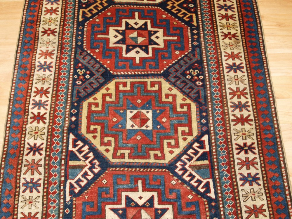 ANTIQUE CAUCASIAN MOGHAN KAZAK RUNNER WITH MEMLING GUL DESIGN, CIRCA 1880. View V