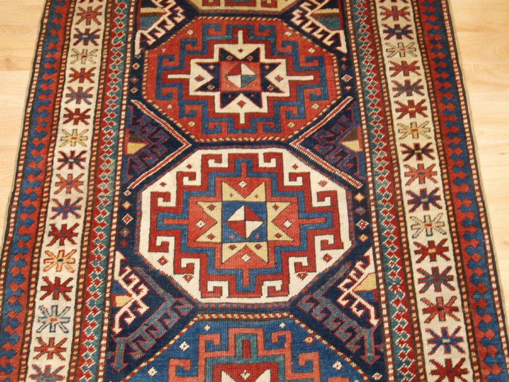 ANTIQUE CAUCASIAN MOGHAN KAZAK RUNNER WITH MEMLING GUL DESIGN, CIRCA 1880. View VI