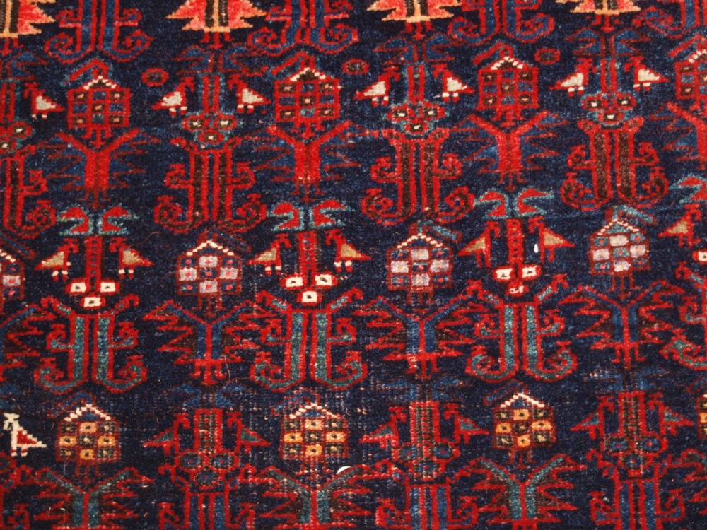 An antique hand-knotted Kurdish Kelleh long rug featuring a deep navy central field with geometric motifs enclosed by an ivory dragon pattern border. View VIII