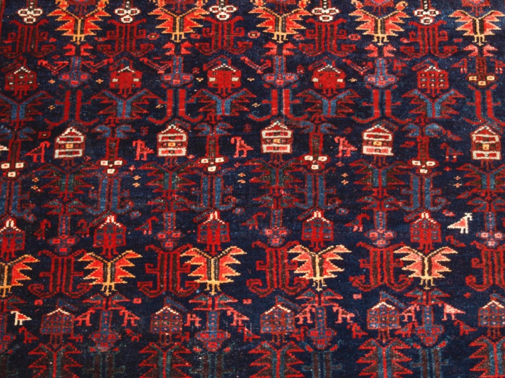An antique hand-knotted Kurdish Kelleh long rug featuring a deep navy central field with geometric motifs enclosed by an ivory dragon pattern border. View IX