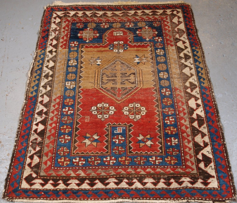ANTIQUE CAUCASIAN BORDJALOU KAZAK PRAYER RUG, CIRCA 1880.