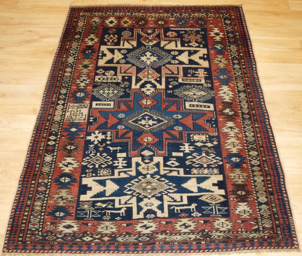 ANTIQUE CAUCASIAN SHIRVAN RUG WITH LESGHI STAR DESIGN, CIRCA 1890.